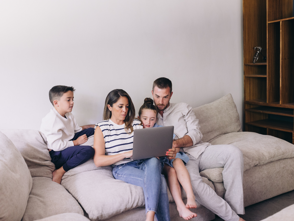 A young family budgeting so they can save for a house deposit while renting