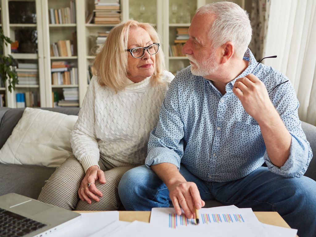 A couple considering selling their rental property with tenants on the lease