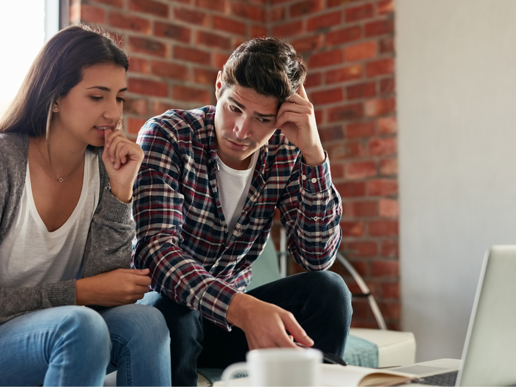 A young couple who have just received a rent increase.