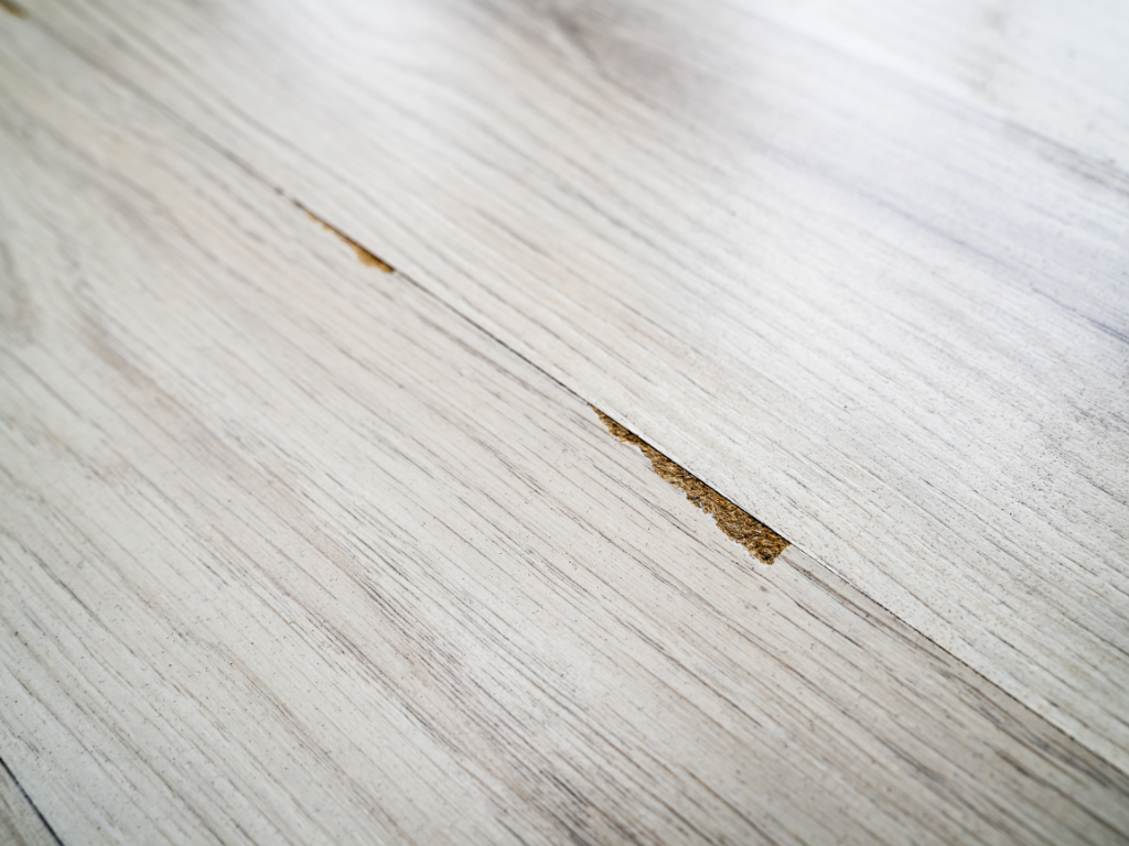 Chipped vinyl flooring in a rental property is deemed damage, not fair wear and tear.