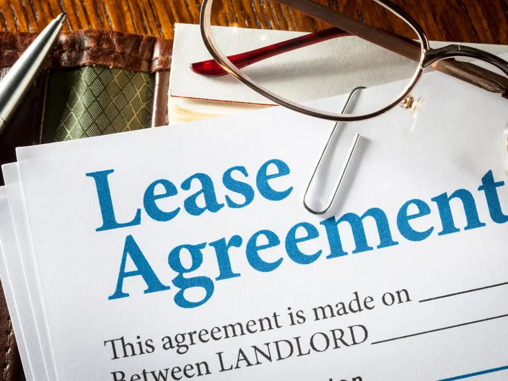 Lease agreement contract with a pair of glasses